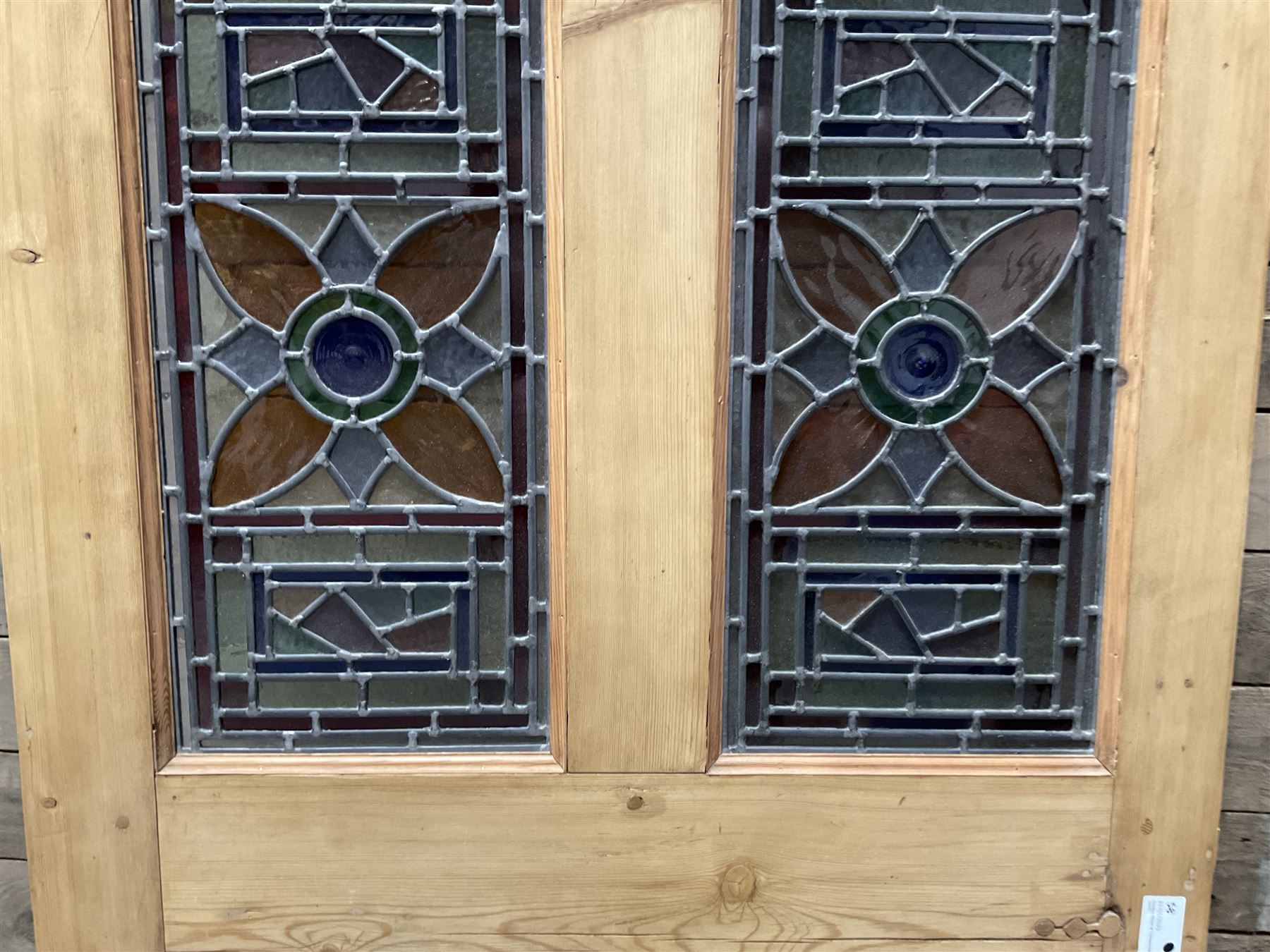 Early 20th century pine six panel door with later stained glass panels