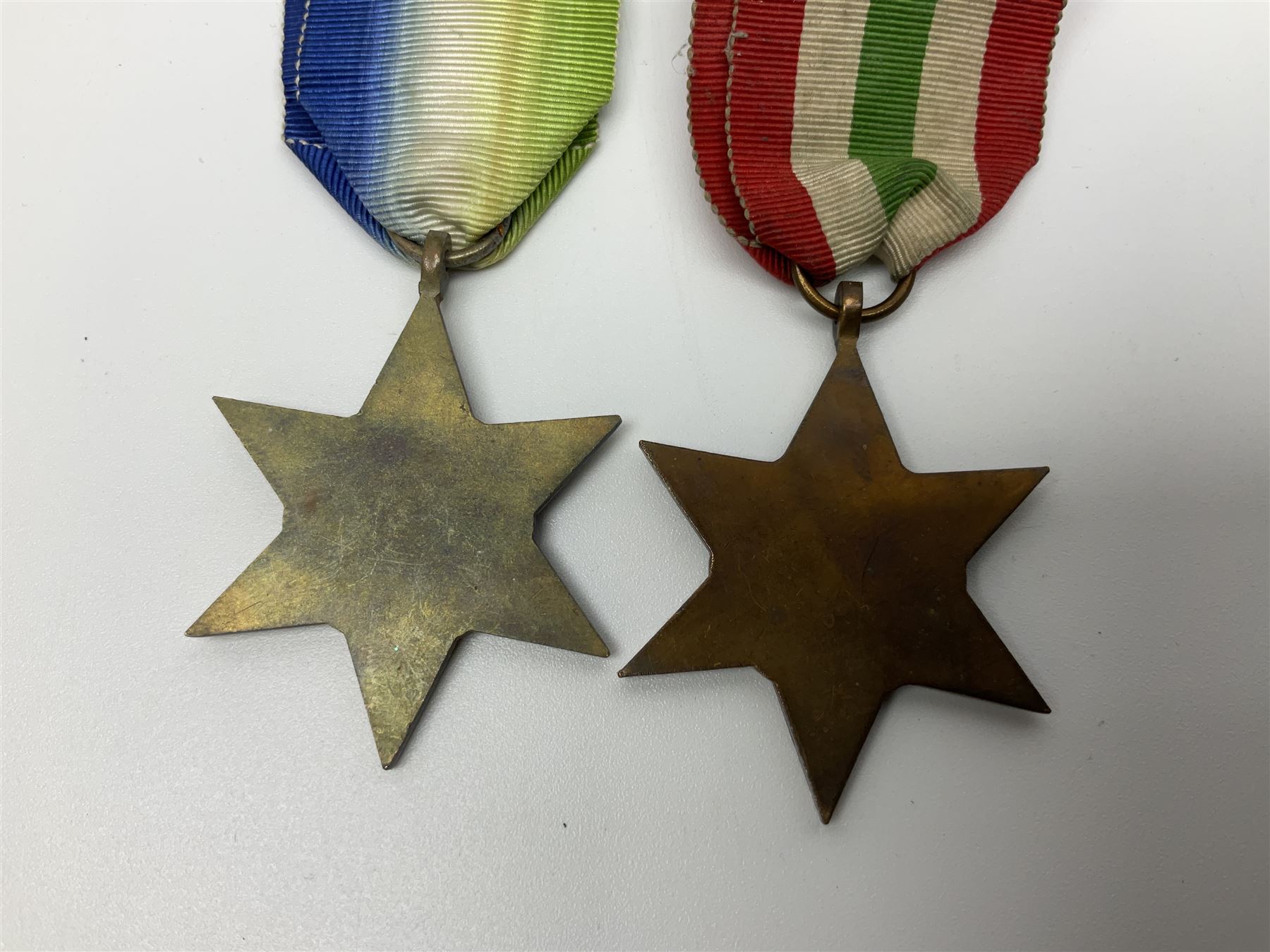 Eleven WW2 medals comprising three 1939-1945 war medals, two Defence medals, three 1939-1945 Stars, Atlantic Star, Africa Star and Italy Star; miniature QEII Naval LS & GC medal; all with ribbons; and WW2 postumous medal slip to Flight Sergeant L.N. Clark