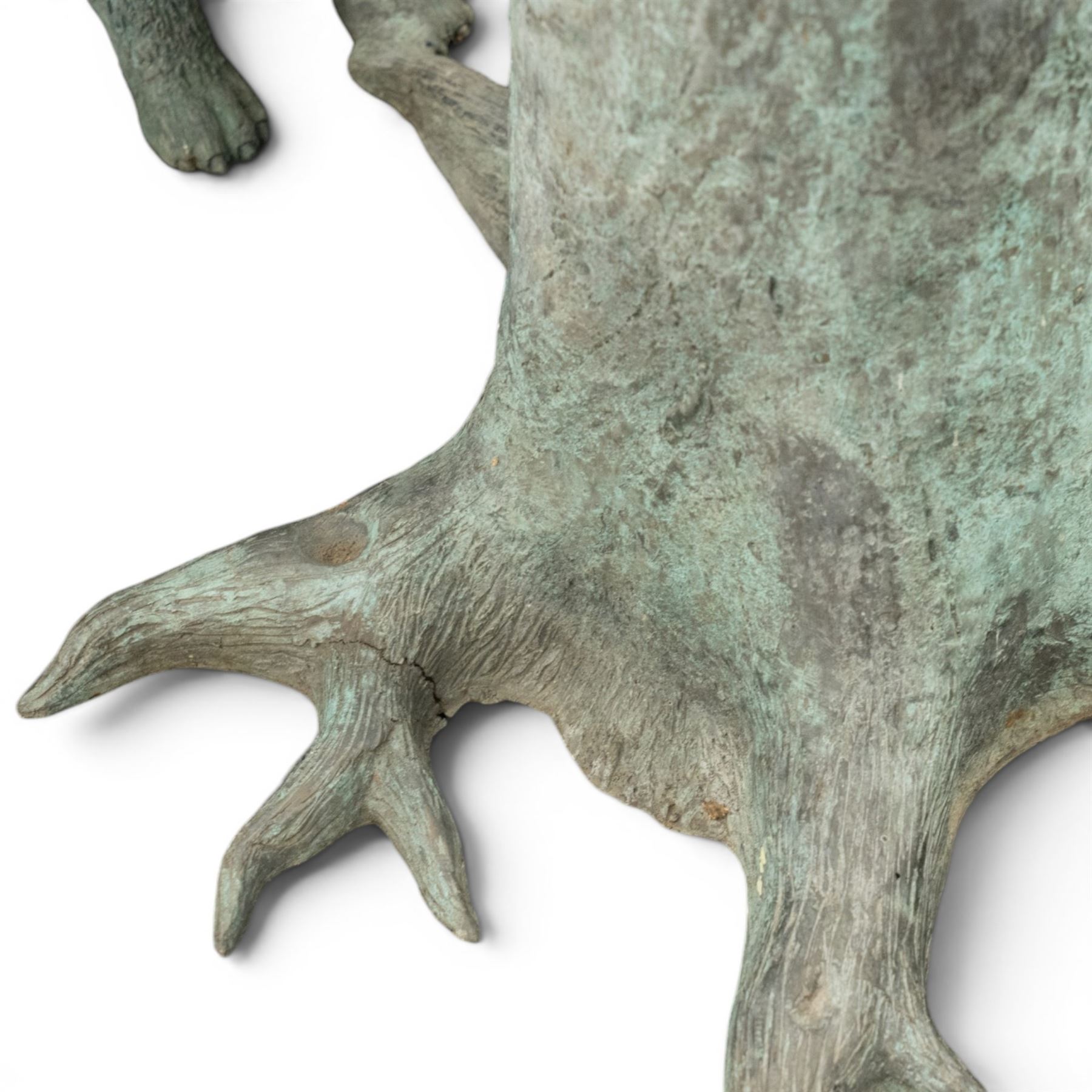 After Eneri Prosperi, bronze garden letterbox, modelled as a seated boy reading on a tree stump, with rustic post box with mail indicator, dog at his feet, textured verdigris finish throughout
