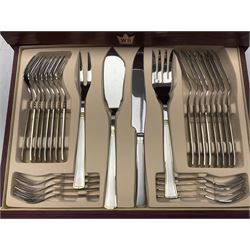 Waltmann und Sohn part canteen of stainless steel and gilt cutlery, the stained wood case with hinged lid above two fitted drawers, L48cm