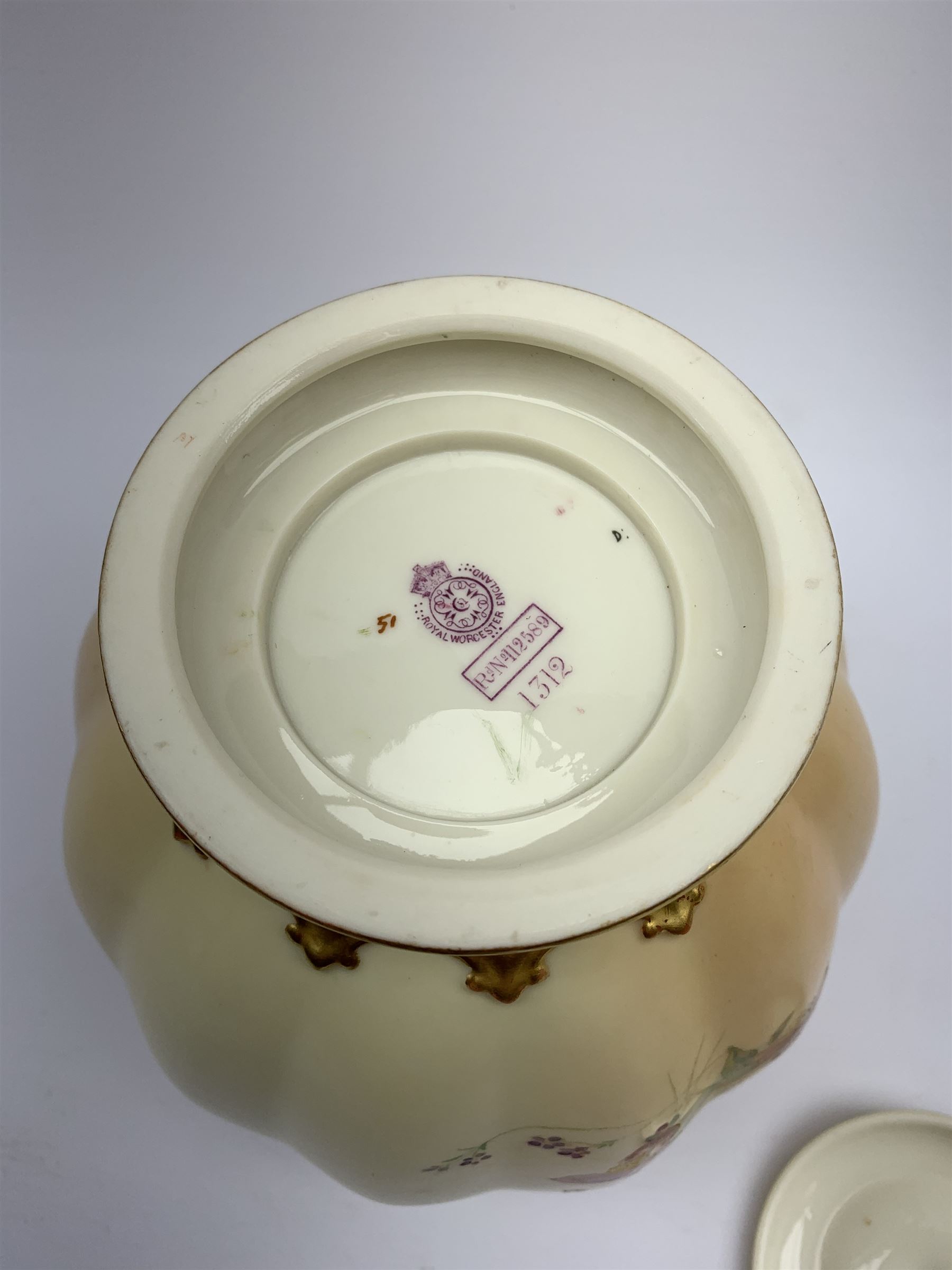 A Royal Worcester blush ivory potpourri jar and cover, of lobed form decorated with floral sprays and heightened with gilt, with printed marks beneath, RdNo112589, shape 1312, overall H19.5cm.