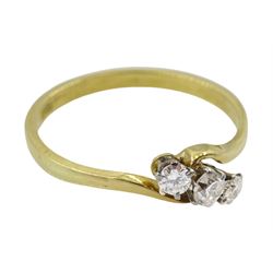 Gold three stone diamond crossover ring, stamped 18ct
