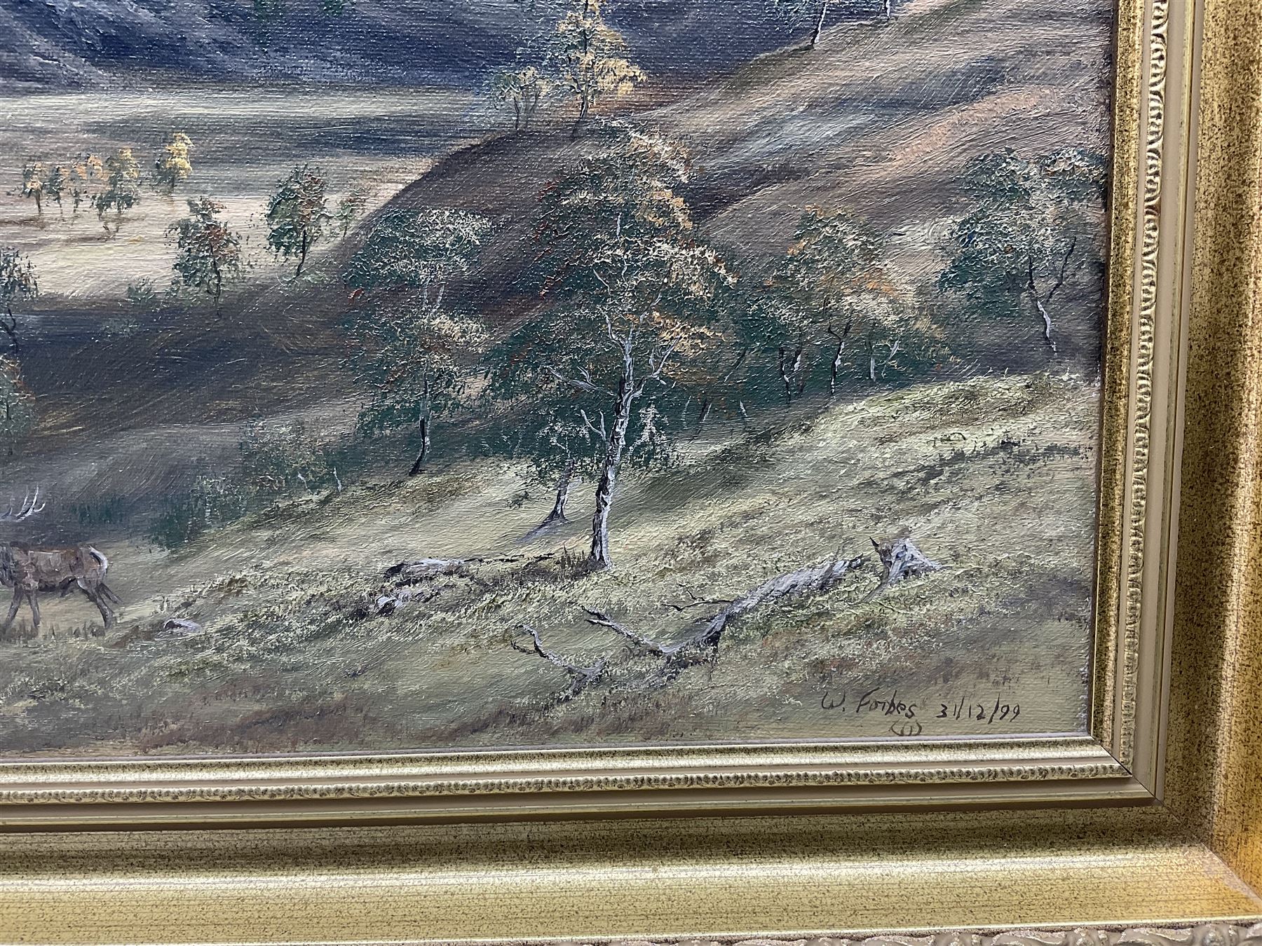 Willie Forbes (Scottish Contemporary): Stag and Deer in the Highlands, oil on canvas signed and dated '99, 34cm x 57cm 
