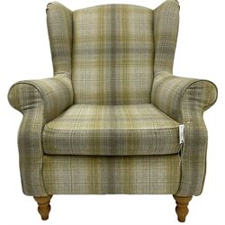 Next Home - 'Sherlock' hardwood framed wingback armchair, upholstered in pale green checkered fabric, on turned front feet