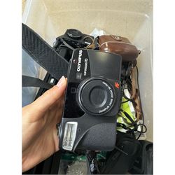 Collection of cameras and camera equipment, including Voigtlander Vitomatic I, Nikon Coolpix P340, Nikon Coolpix S9100, Olympus SP-510UZ, tripod, cases, etc