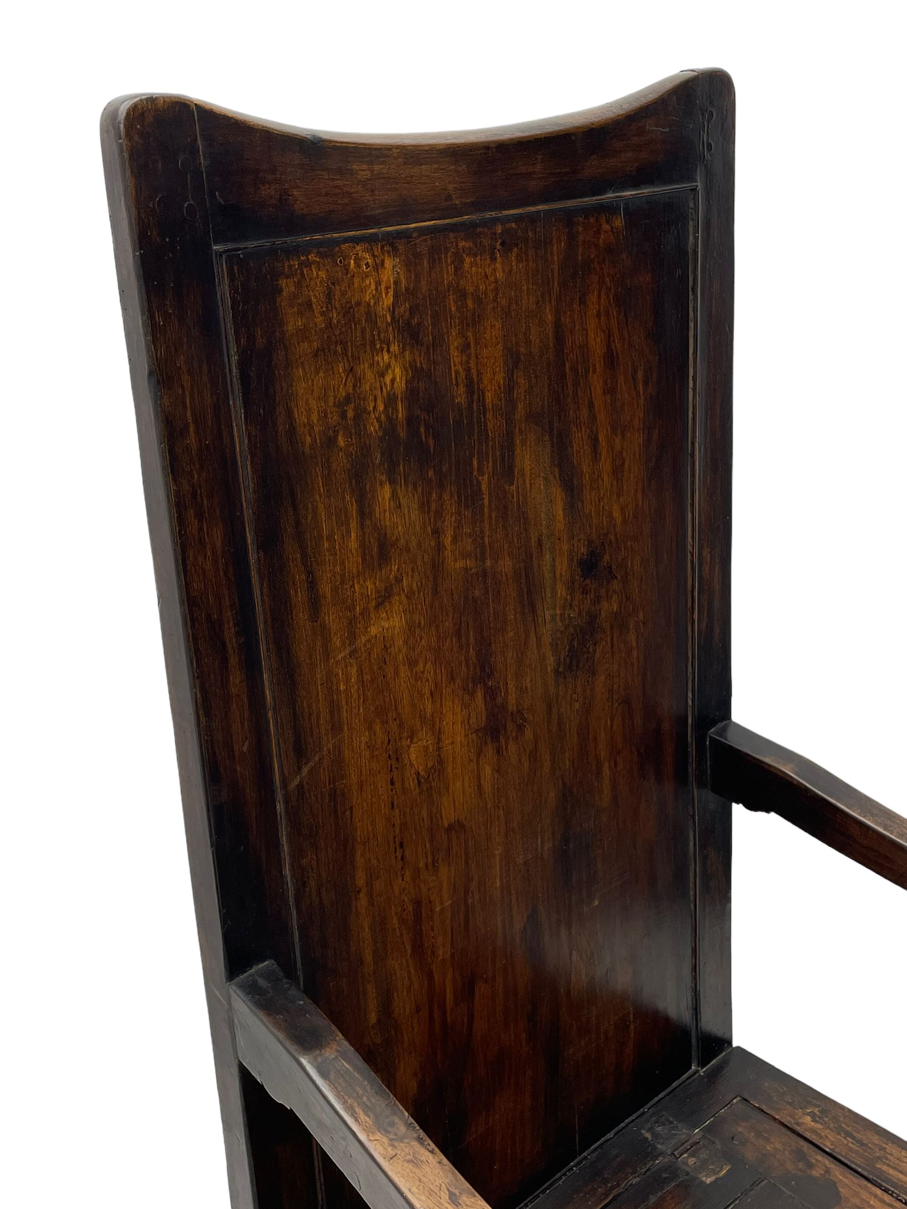 18th century elm box-seat lambing chair, dished cresting rail over panelled back, panelled hinged lid flanked by two turned arm supports