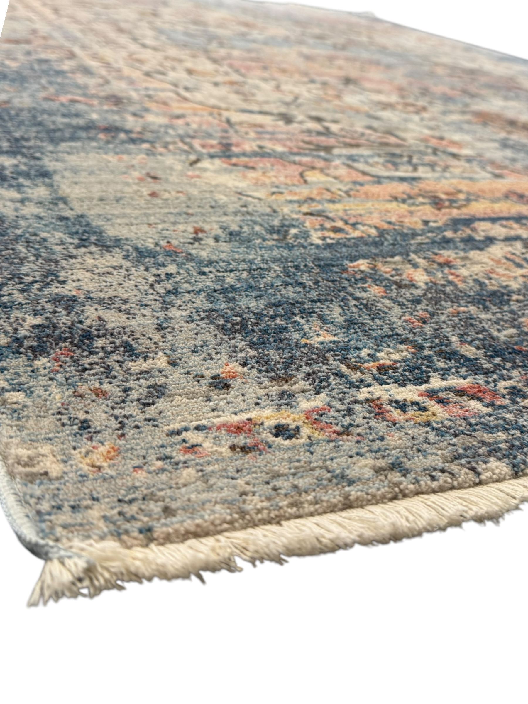 Contemporary Dunelm Soraya Persian design rug, blue and beige ground with faded floral and vine motifs, central medallion and trailing foliate patterns, bordered by a distressed design with stylised floral motifs