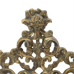 Rococo style gilt wall mirror, the shaped rectangular bevelled plate within a pierced frame of scrolling acanthus leaves, surmounted by a foliate crest