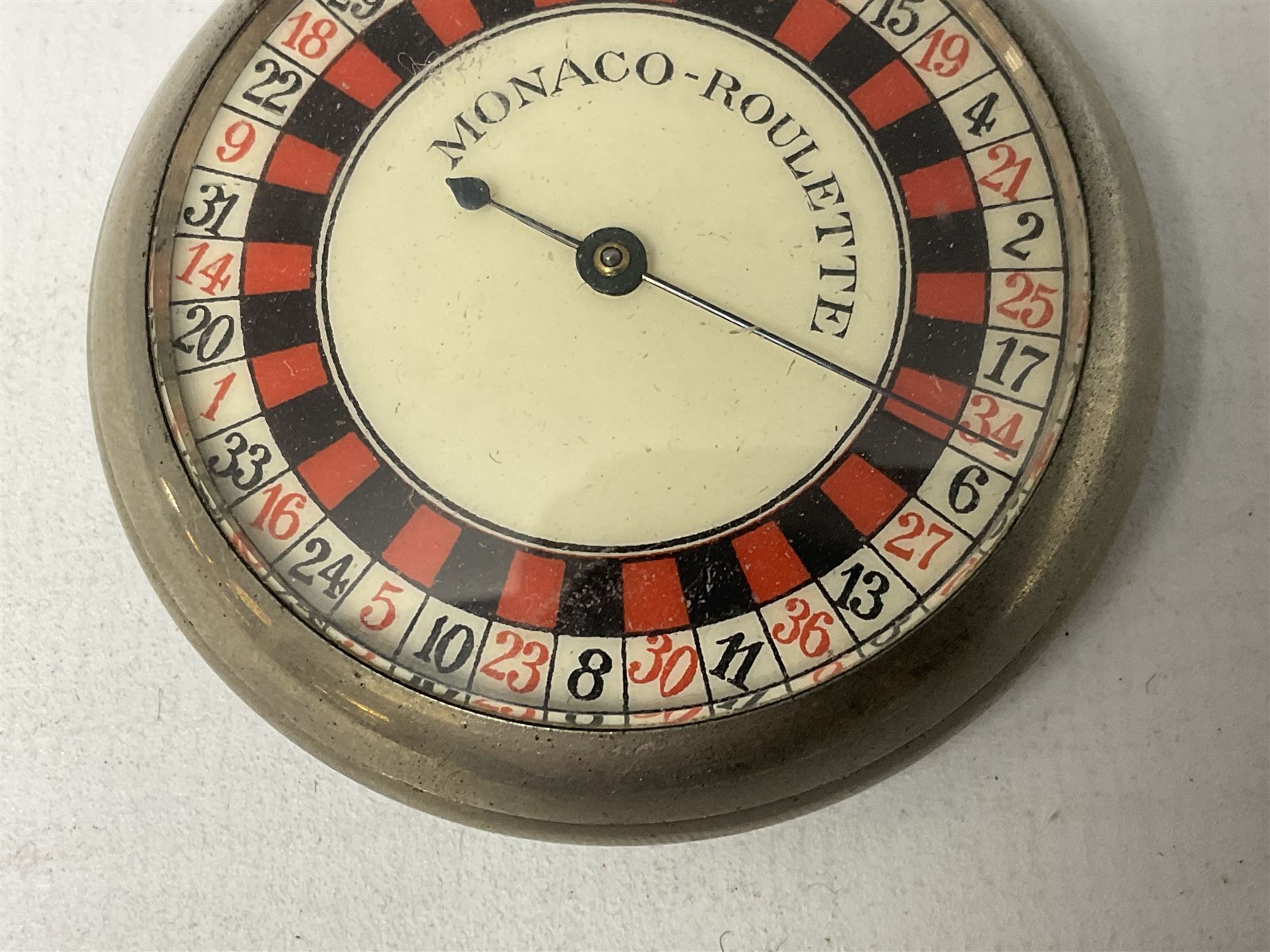 Early 20th century novelty Monaco roulette wheel, with enamel dial in pocket watch case 