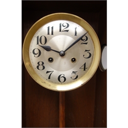  20th century oak cased wall clock with circular silvered Arabic dial, twin train movement striking the half hours on a coil, bevelled glass door, H75cm  