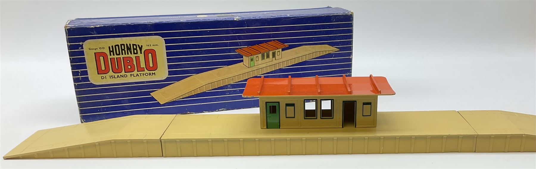 Hornby Dublo - wooden D1 Main Line Station and D1 Goods Depot, both in pale blue boxes; die-cast D1 Through Station in plain blue box; die-cast D1 Island Platform and D1 Signal Cabin, both in blue striped boxes (5)