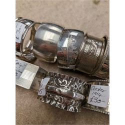 Eleven silver napkin rings, of varying styles and design, mostly hallmarked