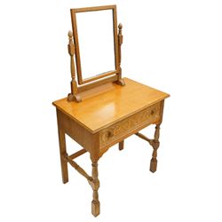 Arts & Crafts design limed oak bedroom suite; comprising dressing table, single wardrobe and chest, with carved scrolling motifs.

Wardrobe (H 181cm, D 47cm, W 79cm)
Chest (H 74cm, D 46cm, W 73cm)
Dressing table (H 136cm, D 47cm, W 74cm)