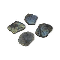 Four polished labradorite coasters with raw edges, approximate D8cm