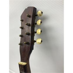 Late 19th century Italian lute back mandolin with segmented bowl back, bears label Gennaro Maglioni Napoli L61cm; in ebonised wooden case; together with another similar damaged Italian lute back mandolin for restoration or spares (2)