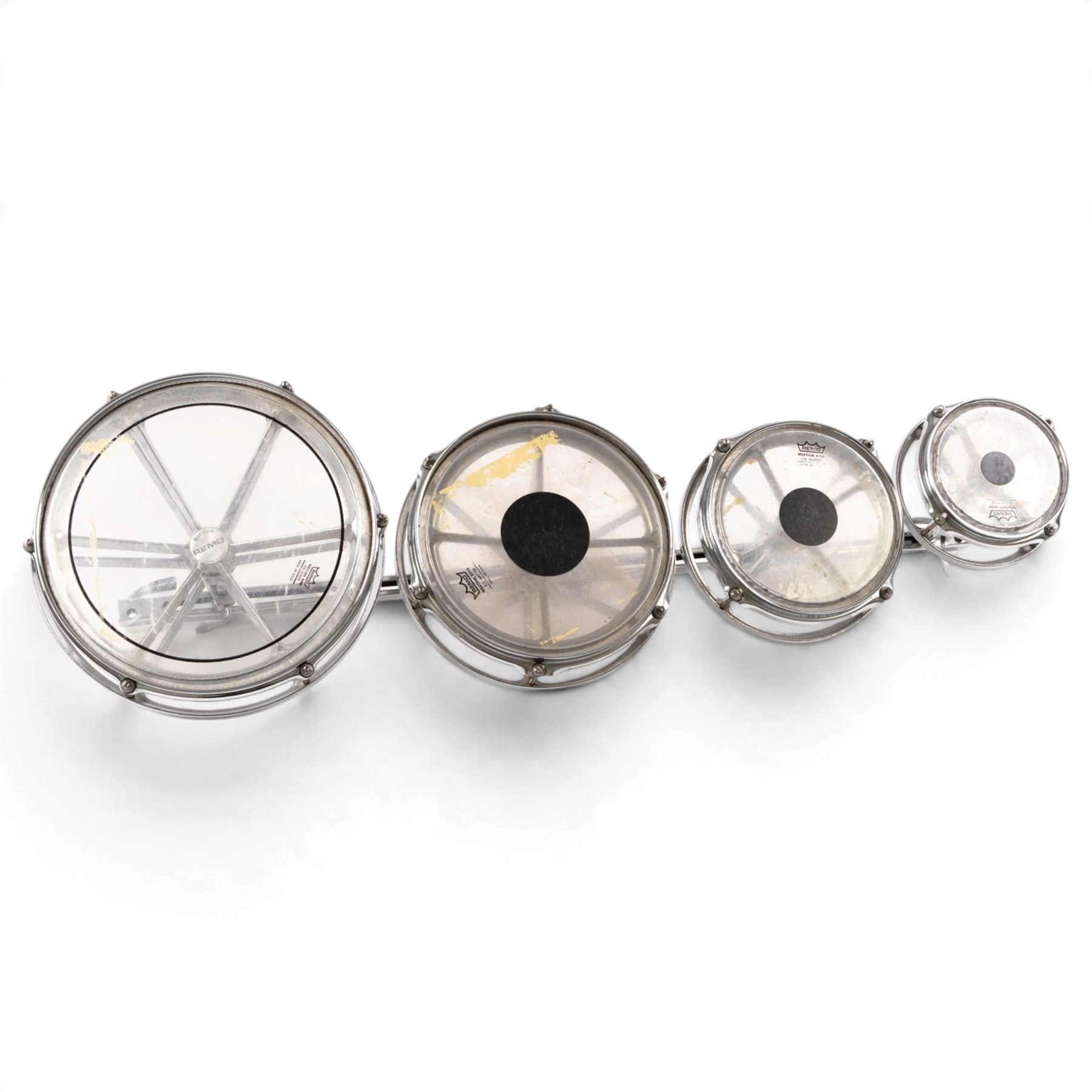 Set of four Remo Roto Toms, with Weather King CS batter heads and chrome tension frames, contained within a fitted carrying case