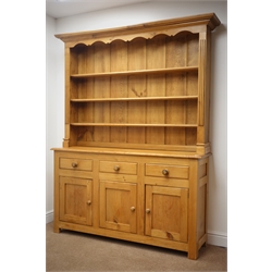  Polished pine dresser, projecting cornice, three shelf back above three drawers and cupboards, W160cm, H198cm, D40cm  