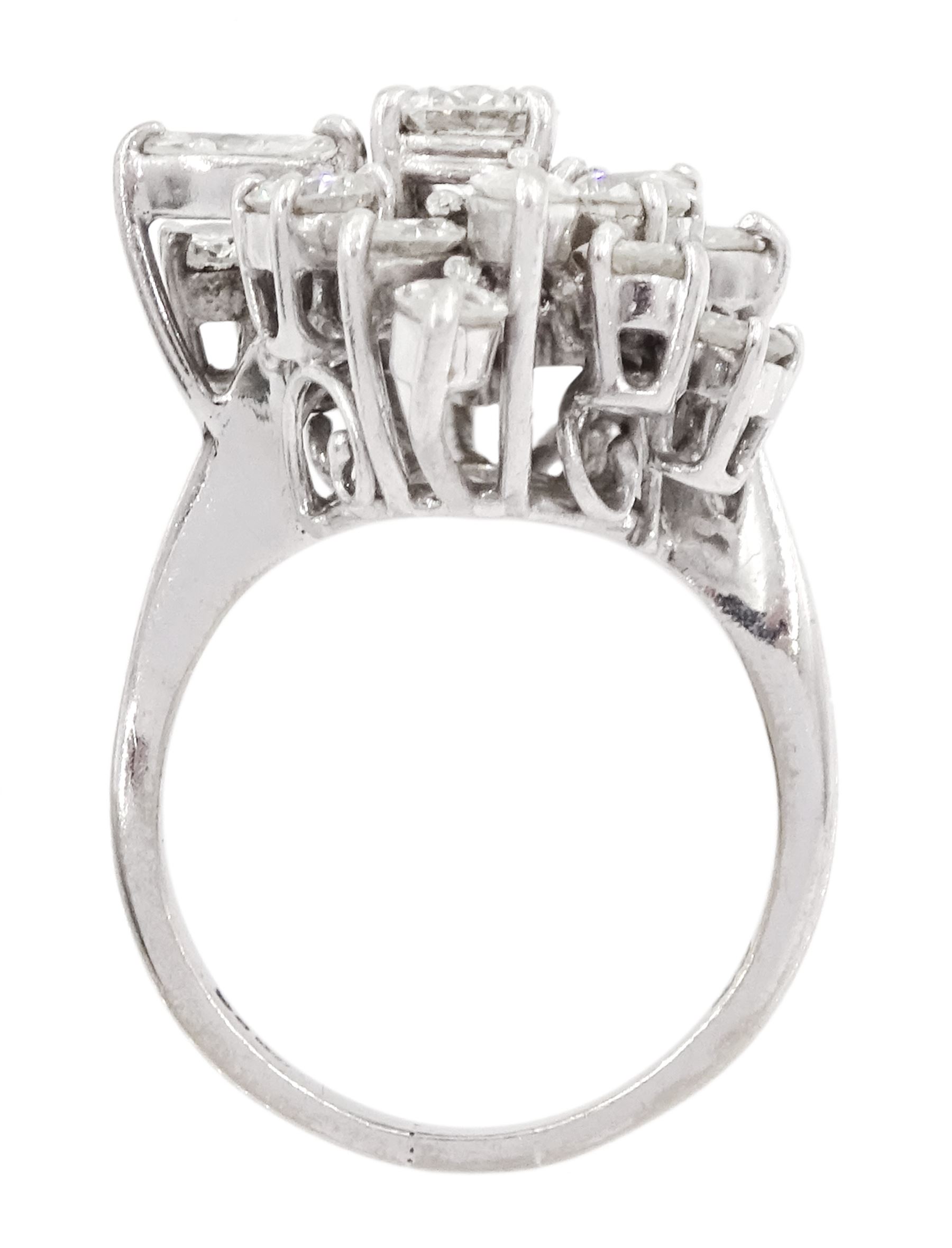 18ct white gold round brilliant cut and marquise cut diamond, stepped design cluster ring, London 1975, total diamond weight approx 3.10 carat
