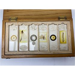 Milbro microscope in a wooden case, together with thirty microscope slides, to include entomology and plant specimens, cased and an additional wooden case with slide inserts, microscope H19cm