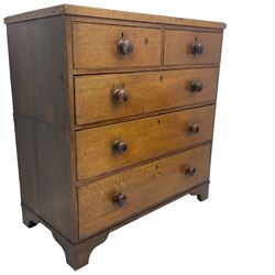 19th century oak chest, fitted with two short and three long drawers, turned wooden handles, on bracket feet