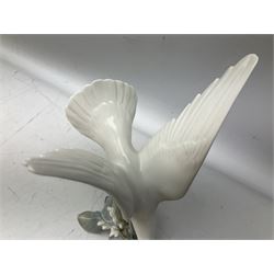Lladro figure modelled as white dove perched upon a branch