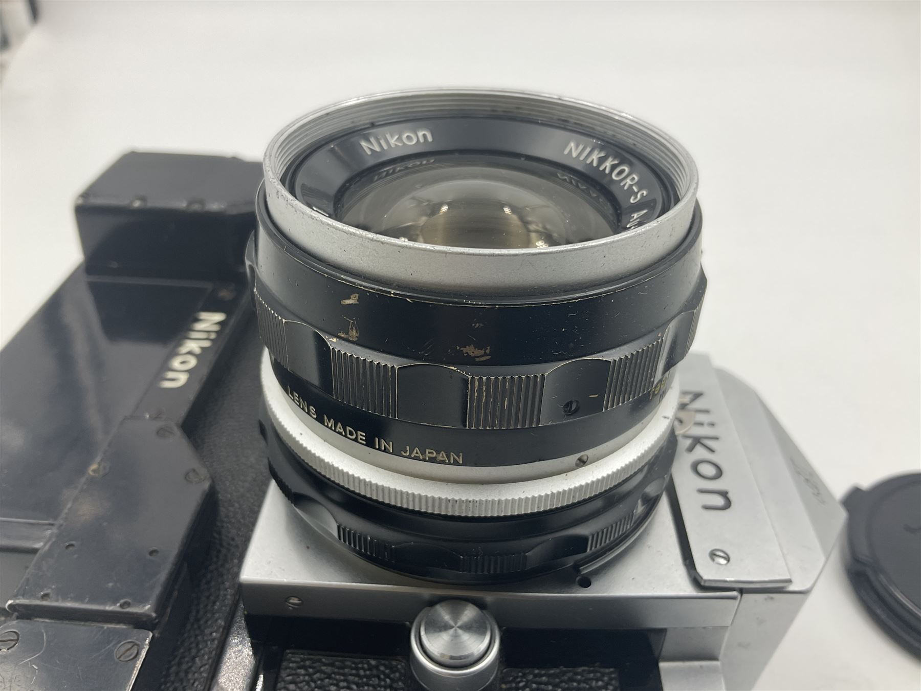 Nikon F NKJ plain prism camera body, serial no. 6520477, with 'Nikon NIKKOR-S Auto 1:2.8 f=35mm' lens, serial no. 344731, Nikon F36 Motor Drive NKJ, serial no. 122780 and Nikon cordless battery pack