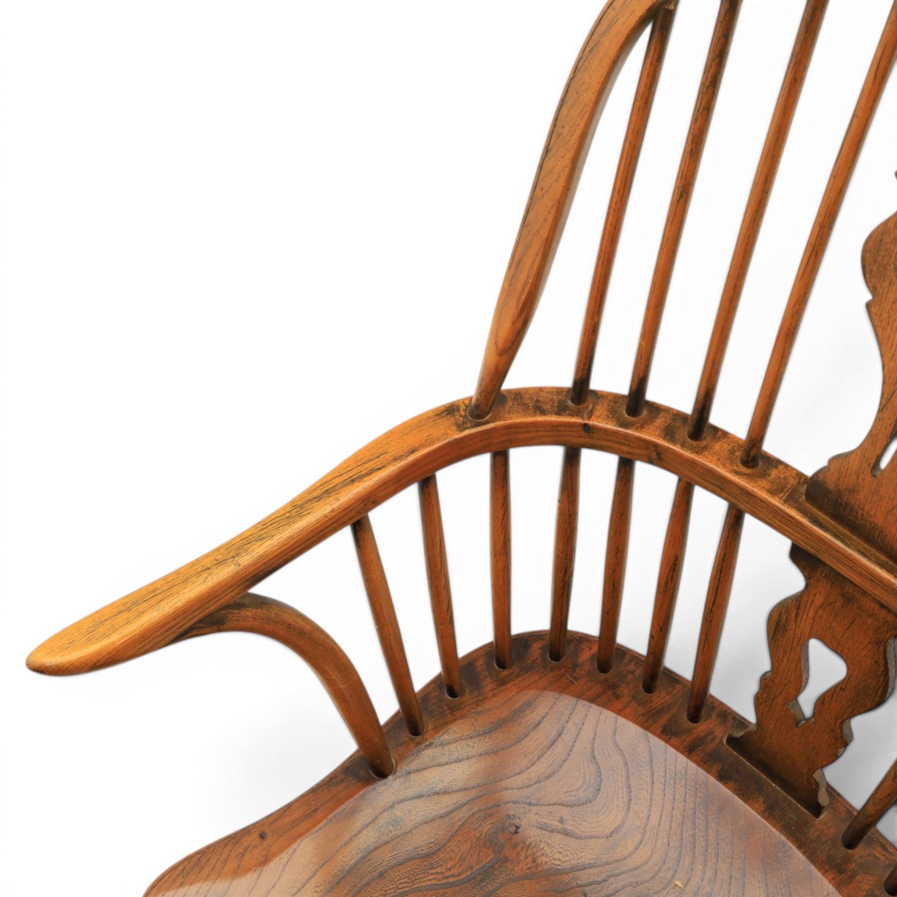 Pair of high back Windsor armchairs, fleur de lis back splat, dished seat, caroline stretcher