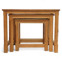 Mouseman - nest of three oak occasional tables, rectangular adzed top, on octagonal supports united by plain stretchers, each carved with mouse signature, by the workshop of Robert Thompson, Kilburn 