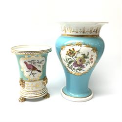 An early 19th century spill vase, in the manner of Spode, of tapering cylindrical form with applied gilt mask detail, and cartouche hand painted with an exotic bird, upon a turquoise glazed border, upon three paw feet, H11cm, together with a larger 19th century vase, of baluster form, panted with a panel containing a floral spray upon a turquoise glazed ground, H16.5cm. 