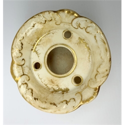 A Rockingham inkwell, with scroll rim, the whole decorated in gilt with a seaweed pattern, with a printed puce mark beneath, D9.5cm. 
