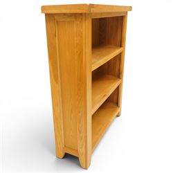 Contemporary solid oak open bookcase, rectangular top over three shelves, on chamfered square feet