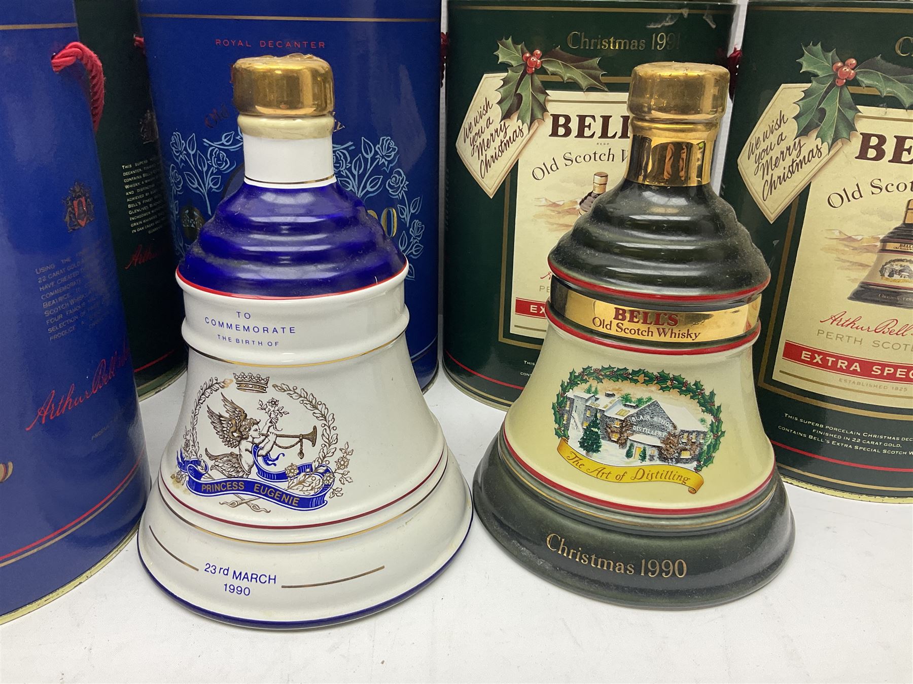 Bells, Scotch whisky, in seven Wade ceramic decanters, including Christmas 1988, 1989, 1990, 1991 etc