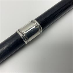 Two early 20th century conductor's ebonised batons each with three silver mounts; one hallmarked London 1915 with presentation plaque 'I.O.R. Presented to Mr. J.R. Maddock 4.1.17' L52cm; the other hallmarked Chester 1908 with vacant cartouche L51.5cm (2)