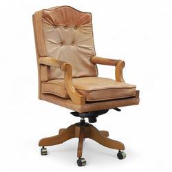 Late 20th century swivel executive desk chair, upholstered in tan leather with brass studd...