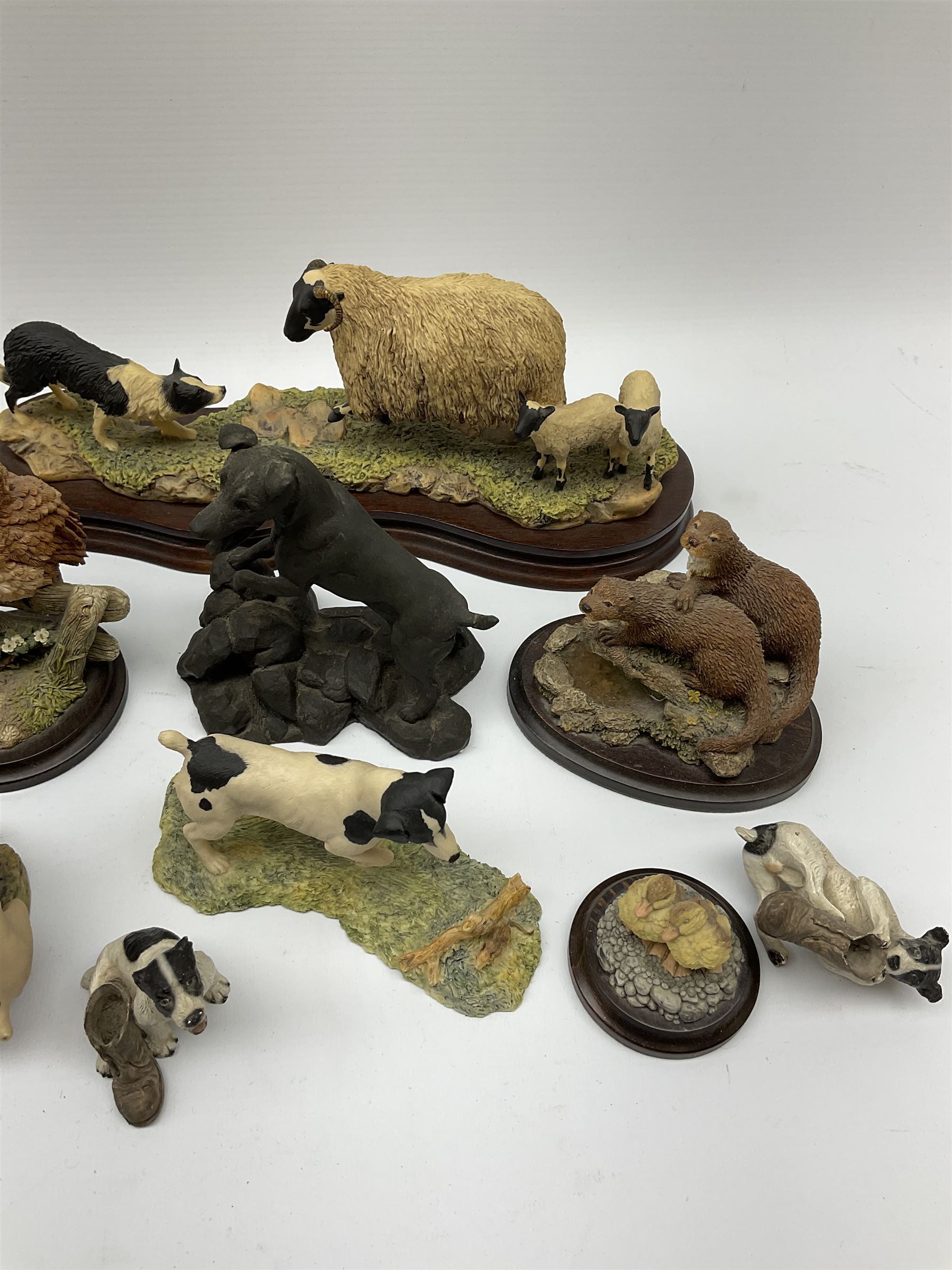 A Border Fine Arts figure, Scottish Black Faced Sheep with Collie, by Ray Ayres, on base, L30cm, together with three further Border Fine Arts figures, two examples modelled as Jack Russel Terriers, the third example modelled as a rabbit, plus a selection of other figures, including five by Country Artists, a bronze effect Heredities figure of a Jack Russel Terrier, etc.