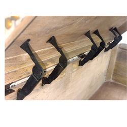 Oka - contemporary mango wood upholstered ottoman, rectangular frame with a printed cotton dhurrie featuring a diamond pattern and wavy stripe border, fitted with brass hinges, decorative studs, and handle