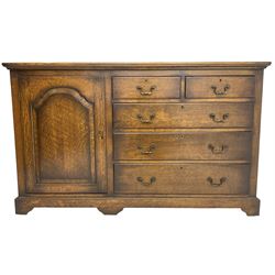 Georgian design oak sideboard, enclosed by arch panelled door and fitted with two short and three long drawers