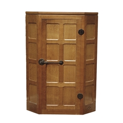  'Mouseman' panelled oak corner cupboard, single door with wrought metal fittings, by Robert Thompson of Kilburn, W70cm, H97cm  