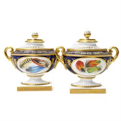 Pair of Royal Worcester Heritage Collection two handled urns and covers painted with opposing oval panels of feathers by David Peplow on pedestal bases W16cm 