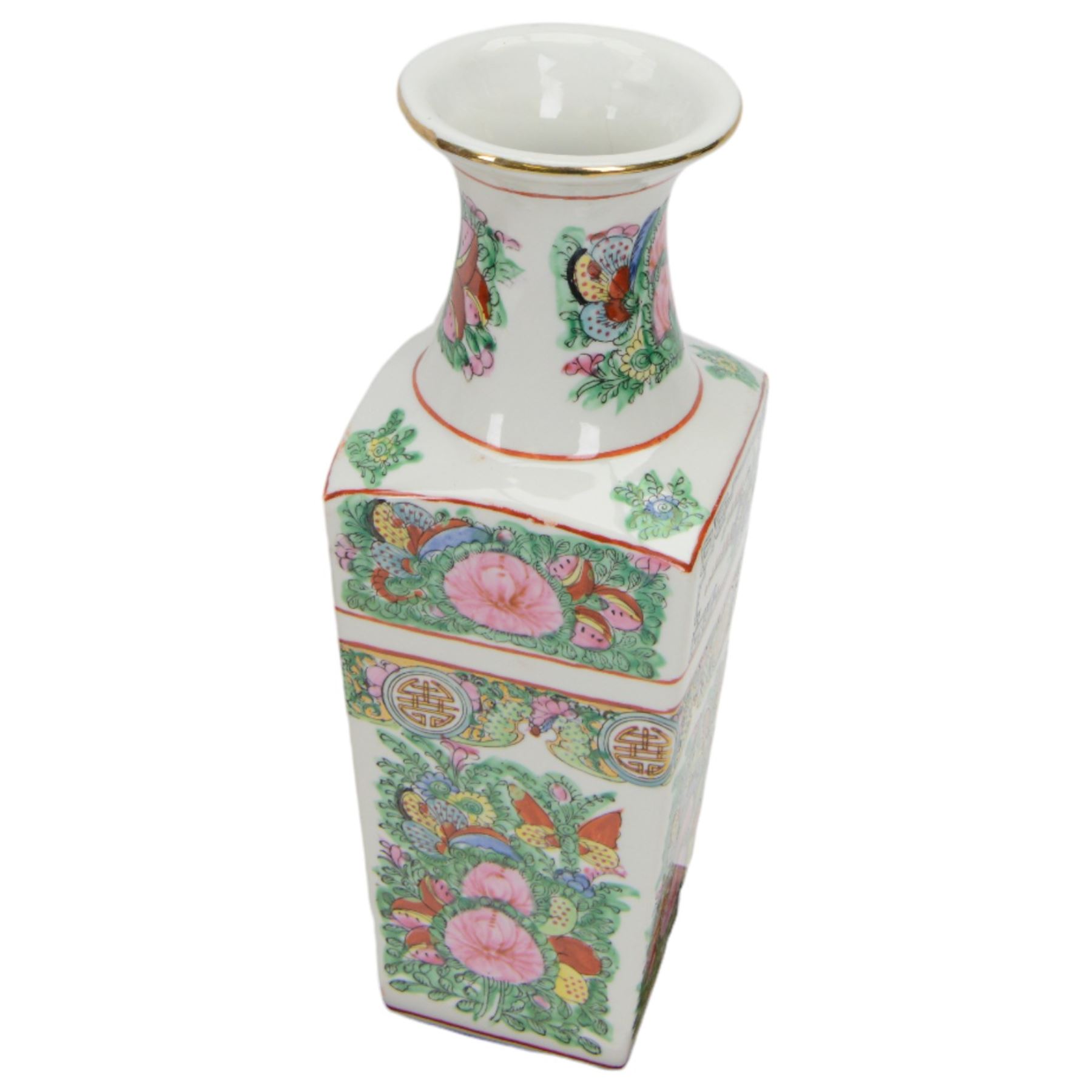 20th century Chinese sang de boeuf vase of baluster form with elephant head handles, togehter with a pair of famille rose vases decorated with floral decoration and insects, upon wooden stands   