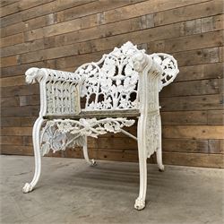 20th century Coalbrookdale design cast iron oak leaf and acorn armchair, white painted cast iron frame with slatted wooden seat, the pierced and shaped back decorated with scrolling oak branches and leafage, flanked by dog mask arm terminals over cabriole supports with paw feet