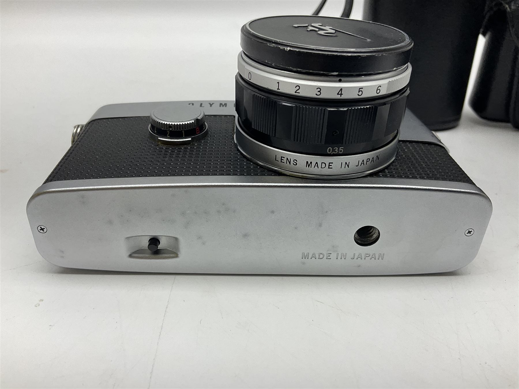 Olympus Pen FV camera body, serial no. 120981, with 'Olympus F.Zuiko Auto-S 1:1.8 f=38mm' lens, serial no. 251523, 'Olympus Zuiko Auto-zoom1:3.5 f=50-90mm, serial no. 135752 and clip on shoe