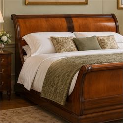 And So To Bed - 5' king size 'Palais' cherry wood sleigh bed, the cylindrical rolled head and foot rails over panelled boards with darker crossbanded detail, shaped scroll ends and moulded plinth base, with Vi-Spring divan base