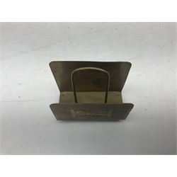 Collection of victorian and later brass desk accessories, to include a letter holder with cherub design, ink well of square form with hinged lid, brass table bell, brass casket with relief decoration, etc  