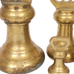 Graduating set of brass bell weights