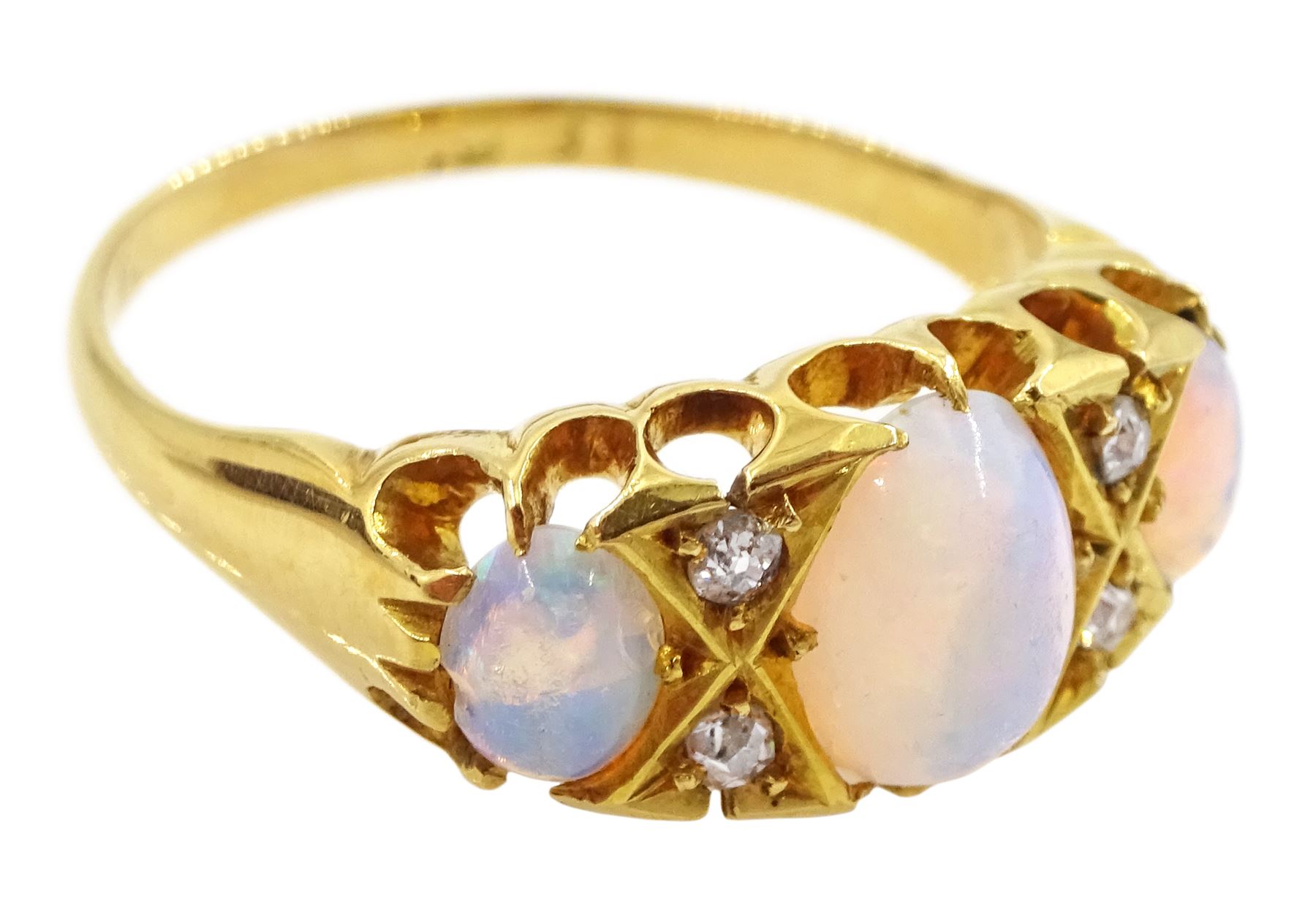 Victorian 18ct gold three stone opal ring, with four diamond accents set between