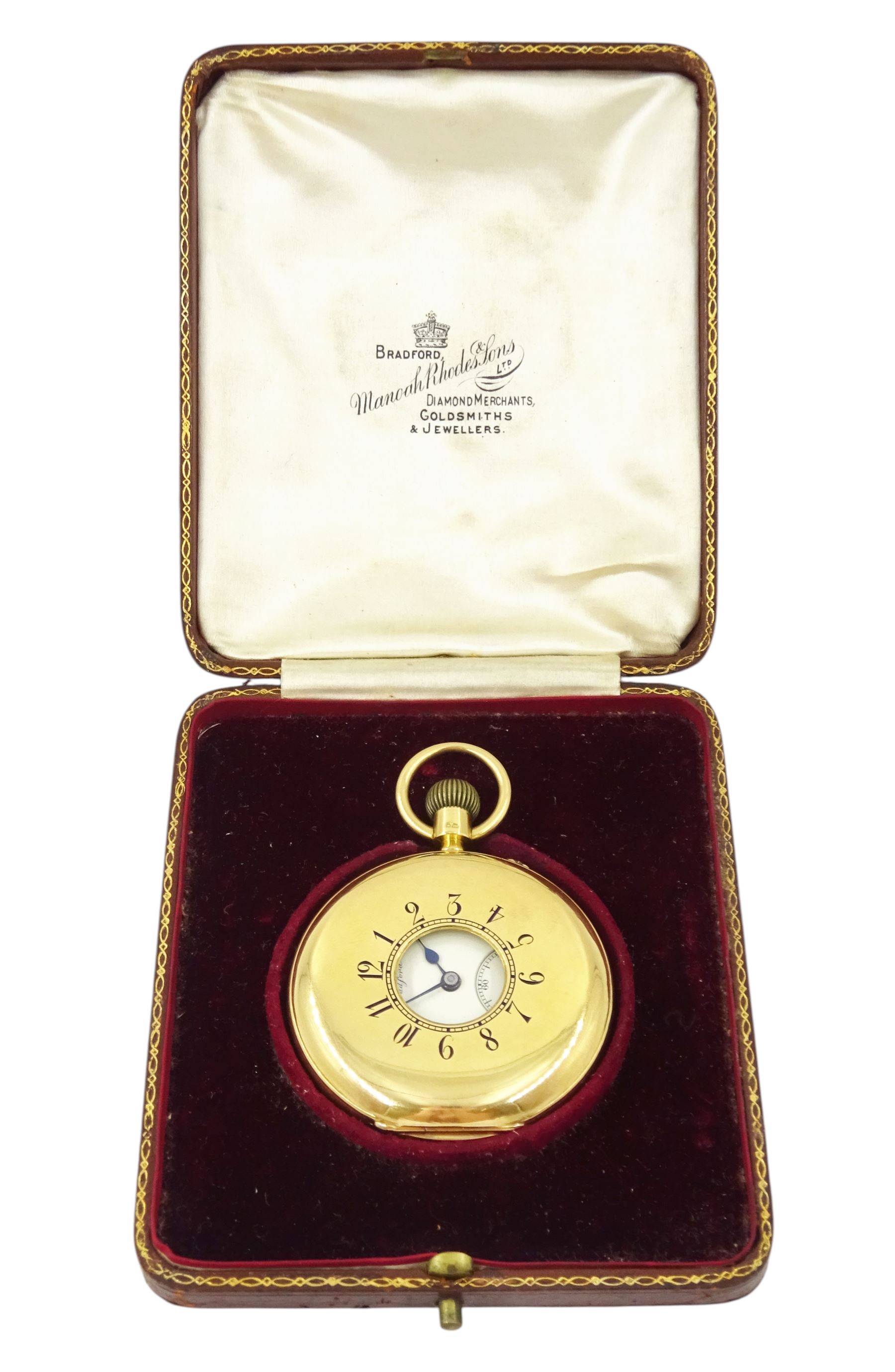 Edwardian 18ct gold half hunter keyless lever presentation pocket watch by Manoah Rhodes & Sons, Bradford, No. 16317, white enamel dial with Arabic hour markers and subsidiary seconds dial, back case monogrammed with initials, markers mark JG, London 1907, in original silk and velvet lined case