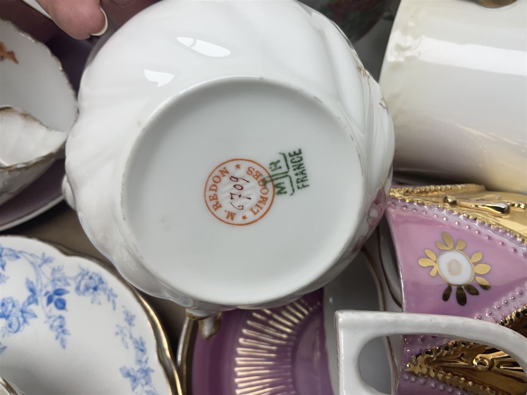Collection of 19th century and later moustache cups, mostly with matching saucers, including hand painted examples