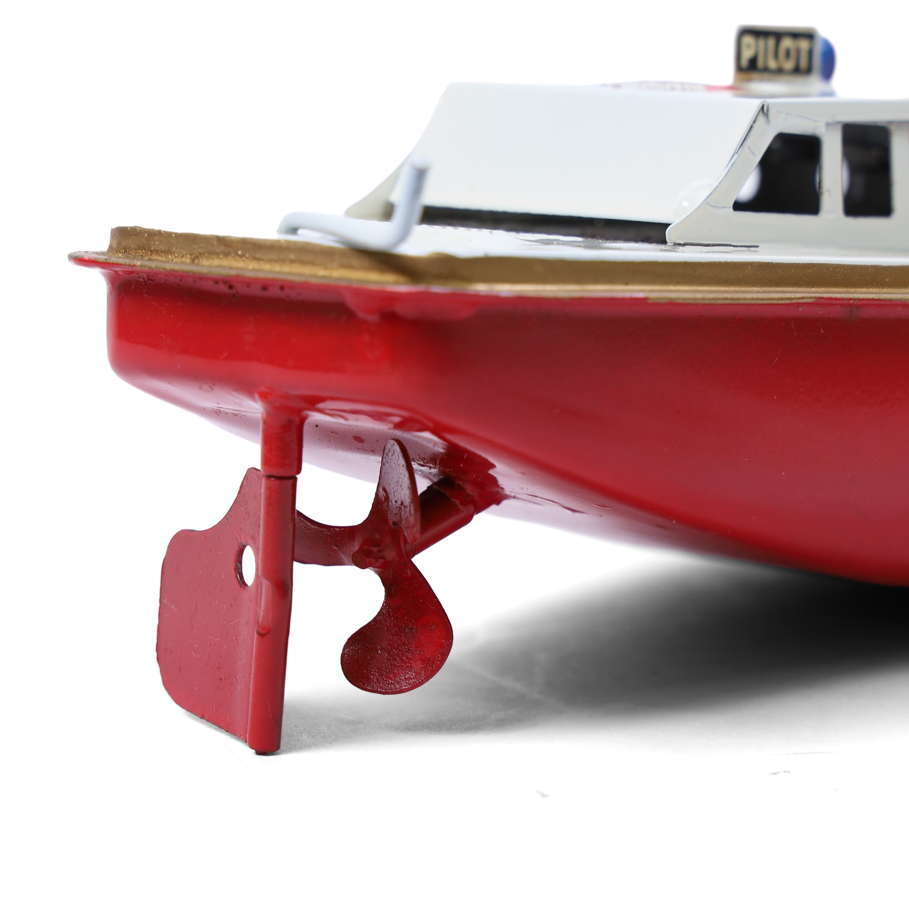 Sutcliffe Models tinplate clockwork Ocean Pilot Cruiser 'Jupiter', in red and white livery with metallic gold details, with key, boxed 