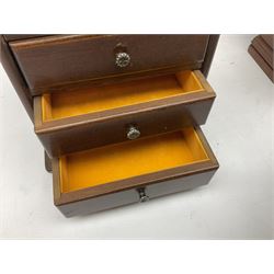 Quantity of miniature furniture to include elm stool supported by four turned legs, walnut kneehole desk, saddleback chair, table top fruitwood chest of drawers etc